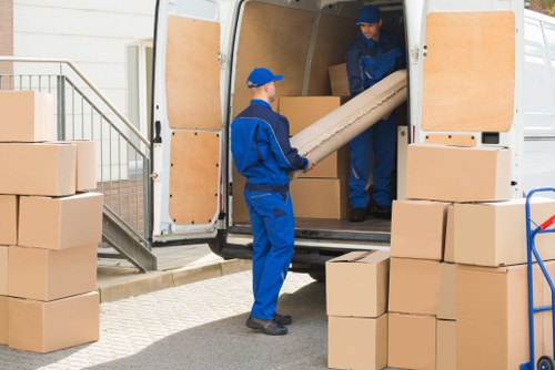 Removal van and moving boxes in a Forest Gate residential street