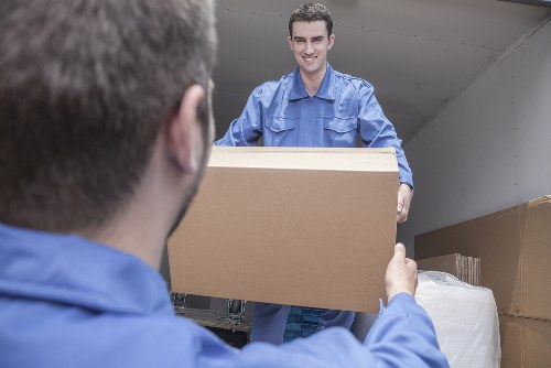 Man with a van loading furniture in Forest Gate