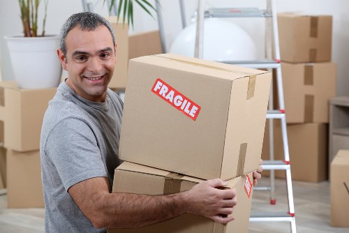 Man and van moving furniture in a Forest Gate residential street