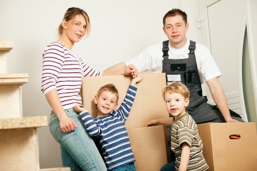 Local moving team loading furniture into a van