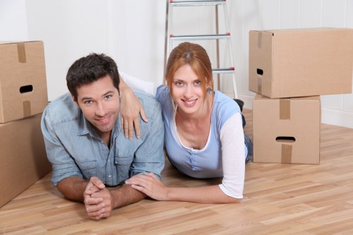 Removal company preparing boxes and furniture for transport