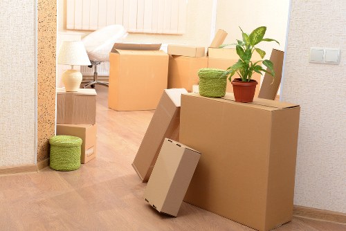 Family home move preparation with boxes and wrapped items